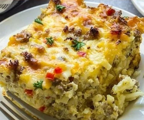 Cheesy Sausage Hash Brown Breakfast Casserole served on a plate.